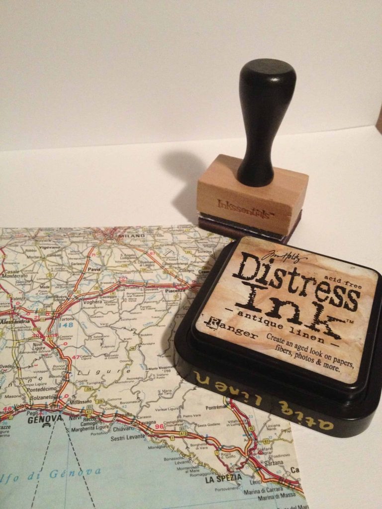 Use a distress ink pad in antique linen and a stamper to give the vintage map for your shadow box and aged look.