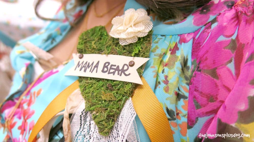 Rustic name tag that says Mama Bear pinned to the clothes custom made for woodland baby shower 