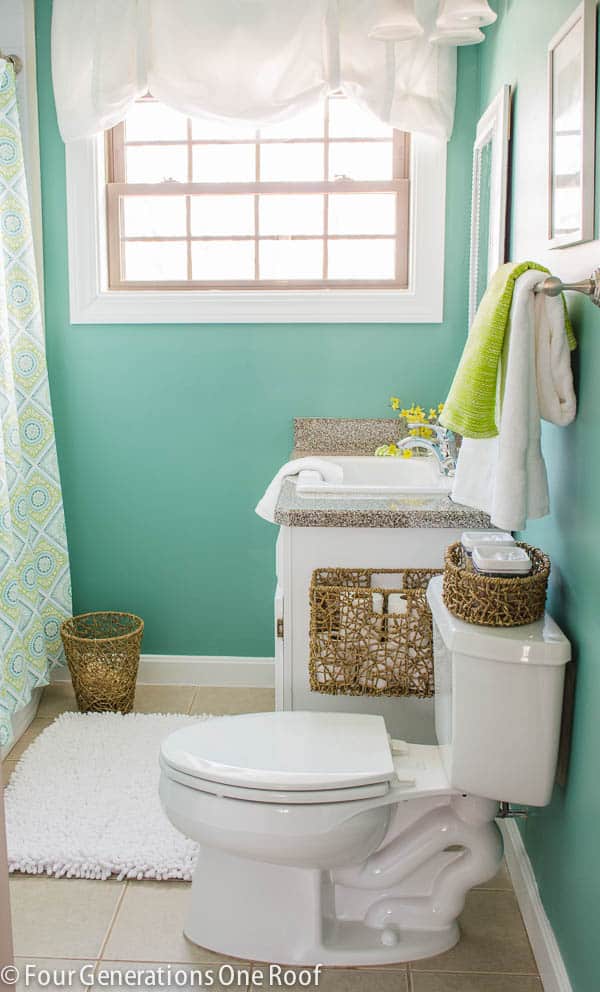 Hang a storage basket to the isde of your bathroom cabinet next of your toilet for storing extra toilet paper rolls