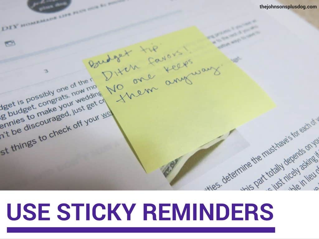 shows a sticky note in a binder that says budget tips, ditch favors! no one keeps then anyway