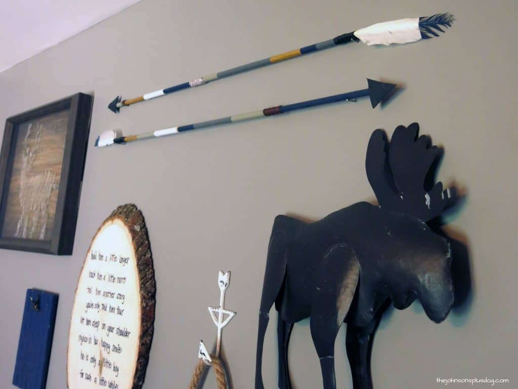 Full close up view of two diy arrows hanging on the wall for gallery wall ideas 