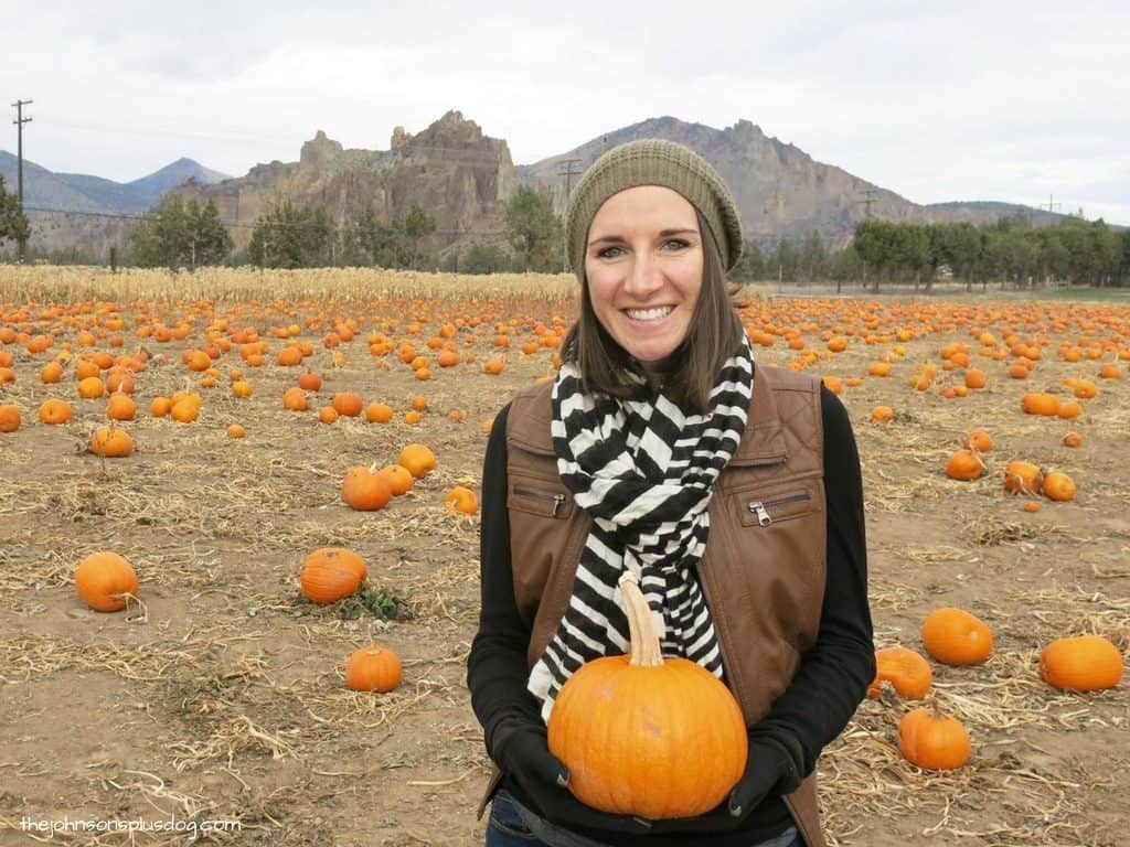 Posing with a little pumpkin for our Fall baby announcement