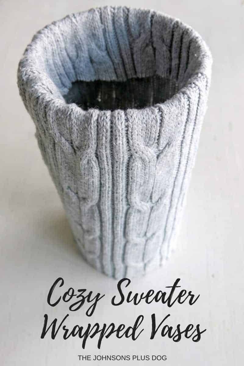 A gray cable knit sweater covered vase sits on a table. Image test overlay reads 