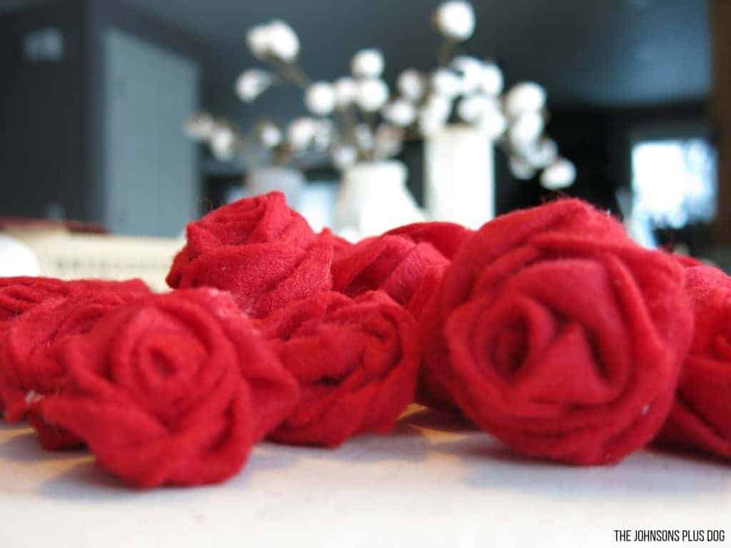 A couple of felt rosettes laying on the table