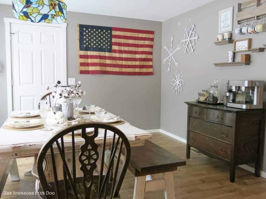 Dining area set up for winter with American flag, popsicle snowflakes, and home coffee corner