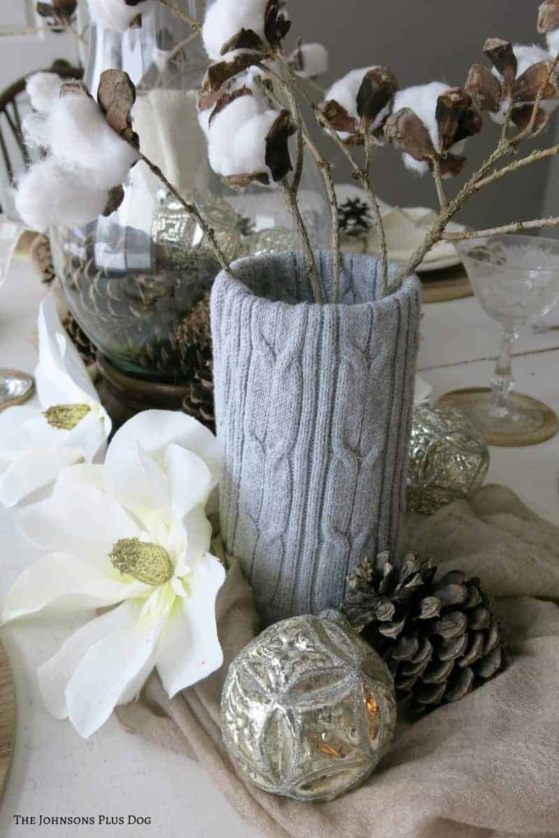 the perfect winter tablescape centerpiece: faux cotton stems in cozy sweater-covered vases