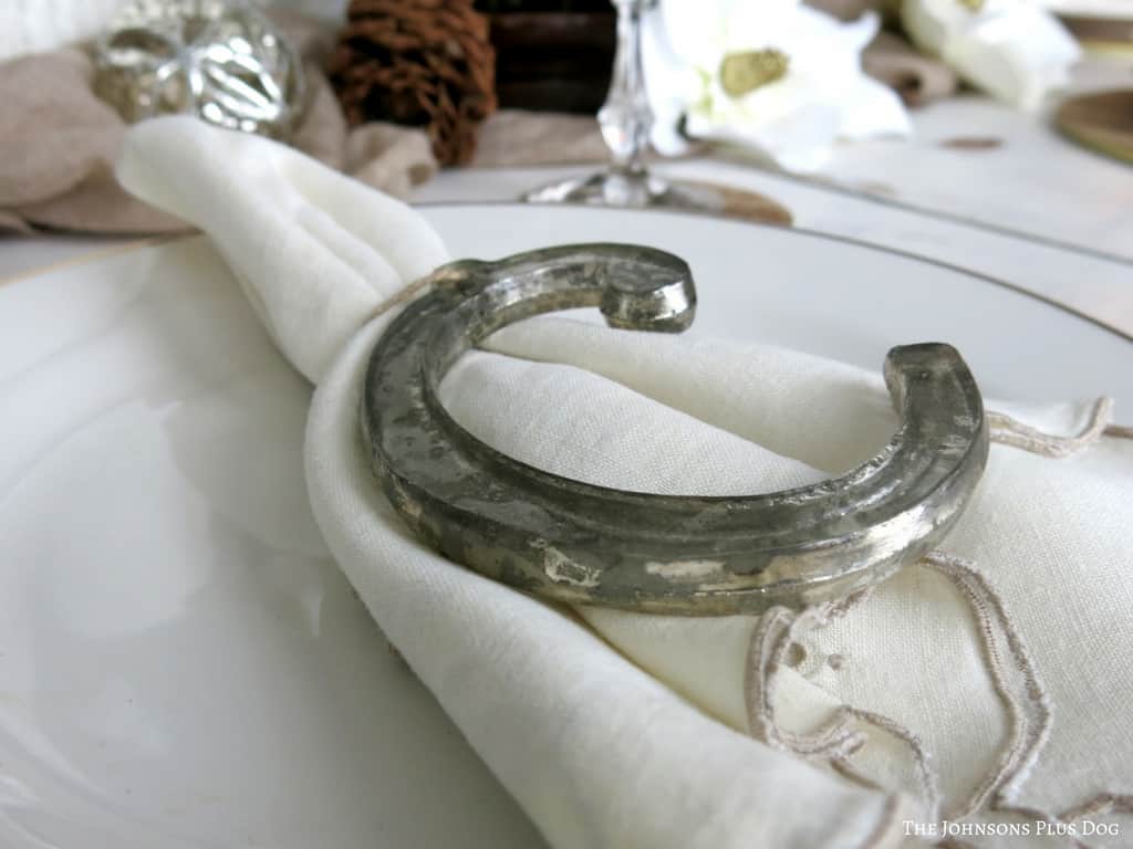 I love using creative pieces like ornaments for place settings, like this weathered letter C ornament