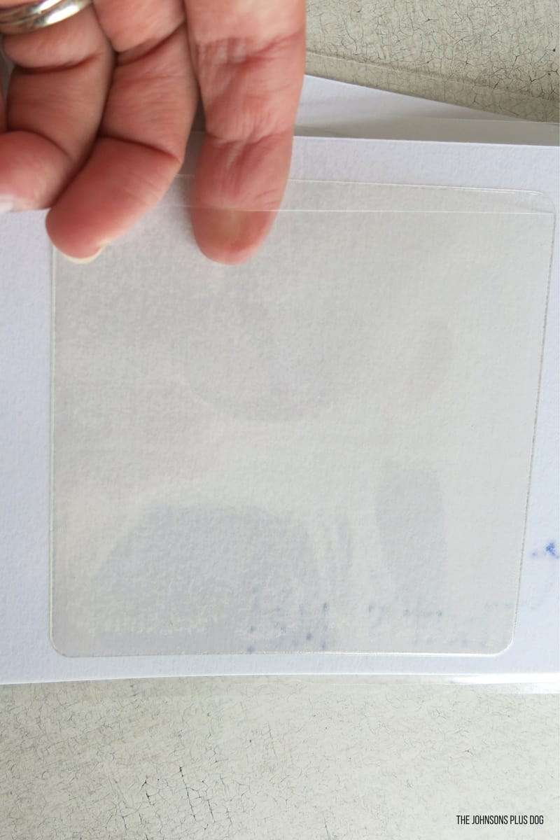 An empty photo pocket attached to the back of the laminated cards for the photo flipbook.