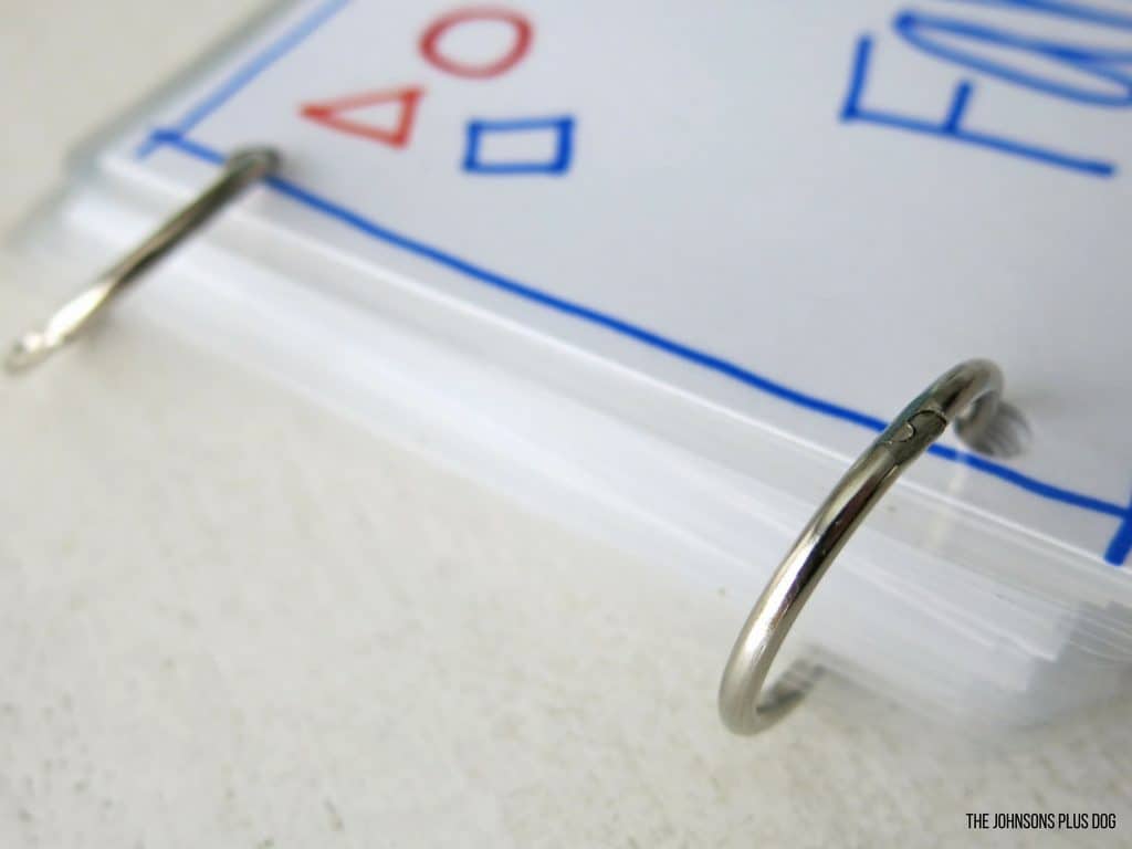 A close up look at the metal binding rings used to hold together our baby's family photo flipbook.