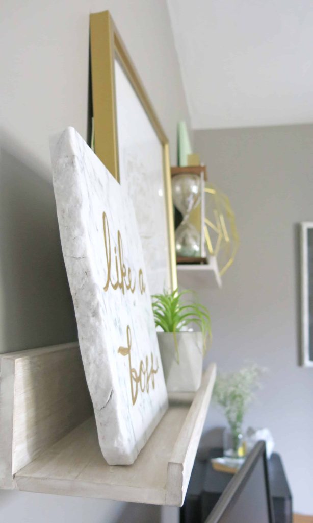 These floating art shelves are front Minted and are perfect for displaying art work in a home office space