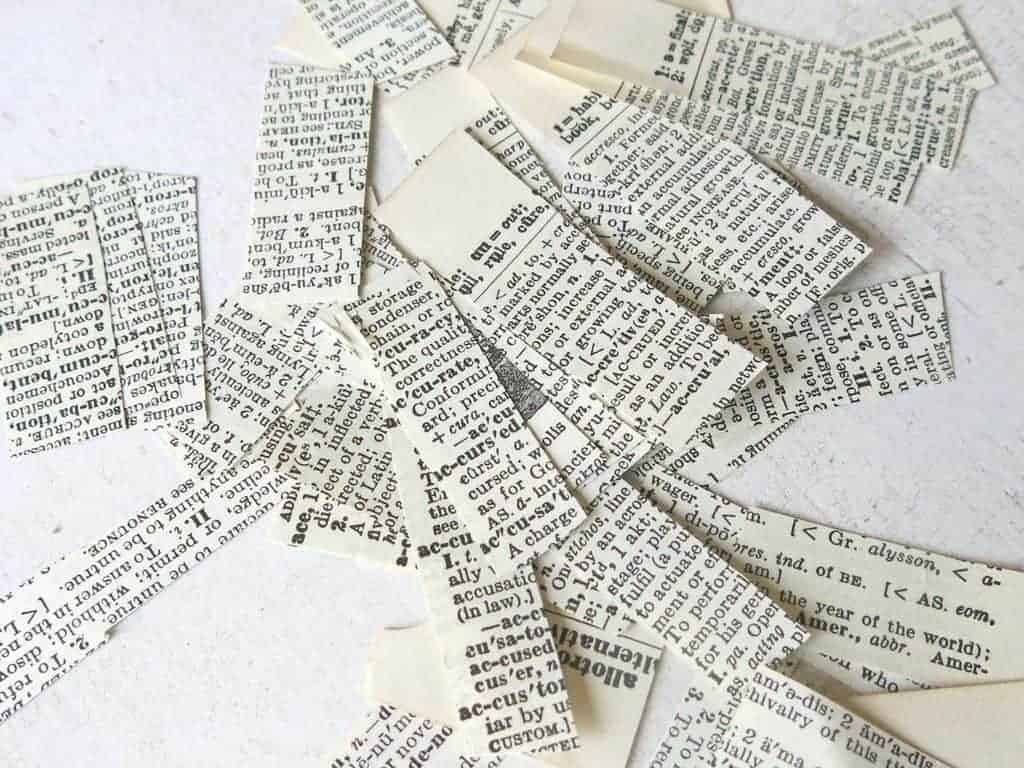 Cut strips of paper from a vintage book