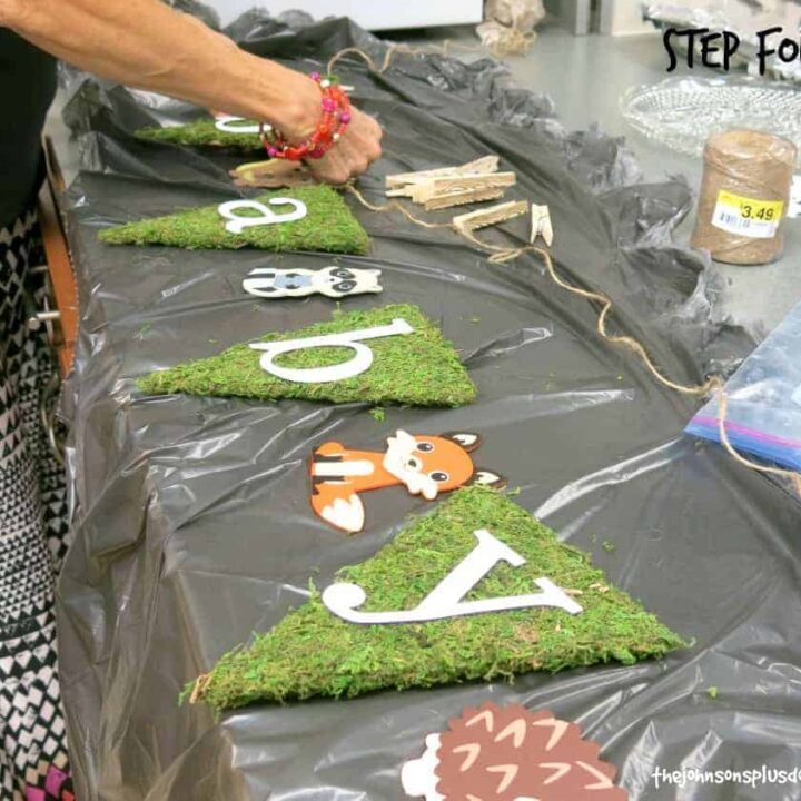 Easy moss covered banner for rustic woodland baby shower