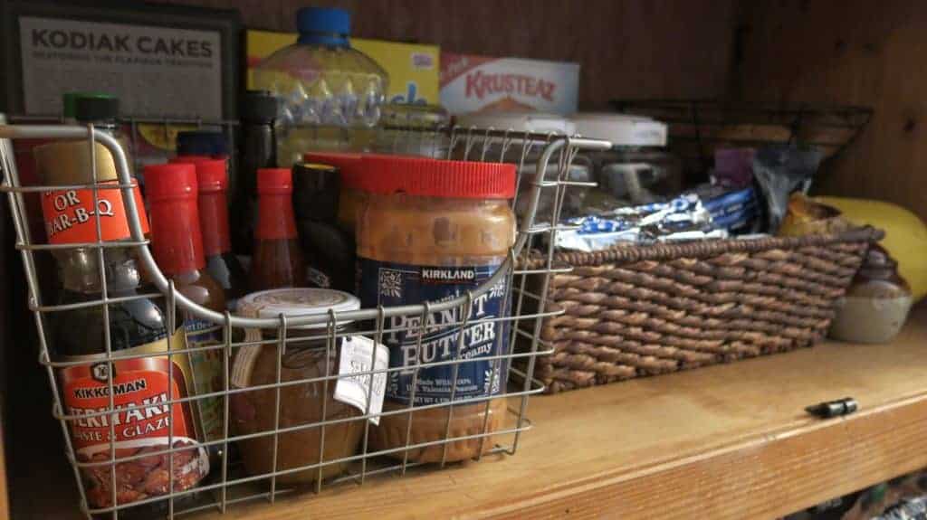 Wire baskets in DIY pantry to organize food