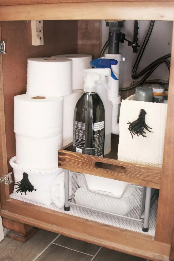 Always layer your storage baskets and bins in your bathroom when organizing under the sink