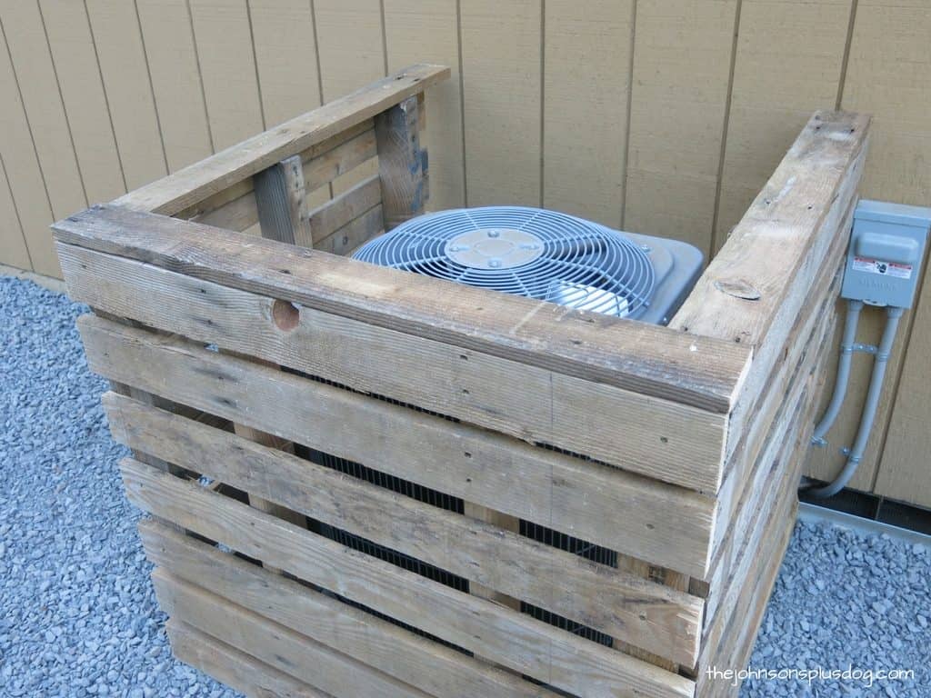 A look at our completed pallet wood AC unit cover, with top rails installed for the finished look!