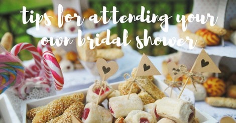 Cropped image of a snack table, with finger foods and text overlay that reads "tips for attending your own bridal shower"