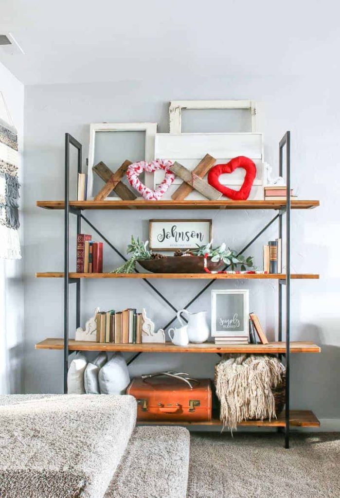 I love the look of these living room farmhouse shelves with the DIY XOXO Valentine's Day home decor at the top most shelf along with other farmhouse home decor