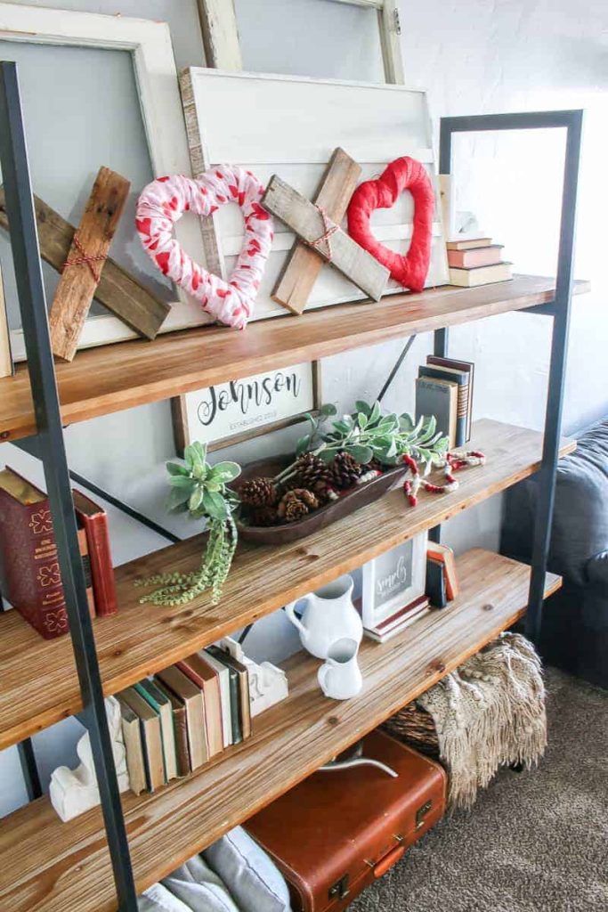 Living room shelves withValentine's Day DIY wooden XOXO decor  along with other farmhouse home decor