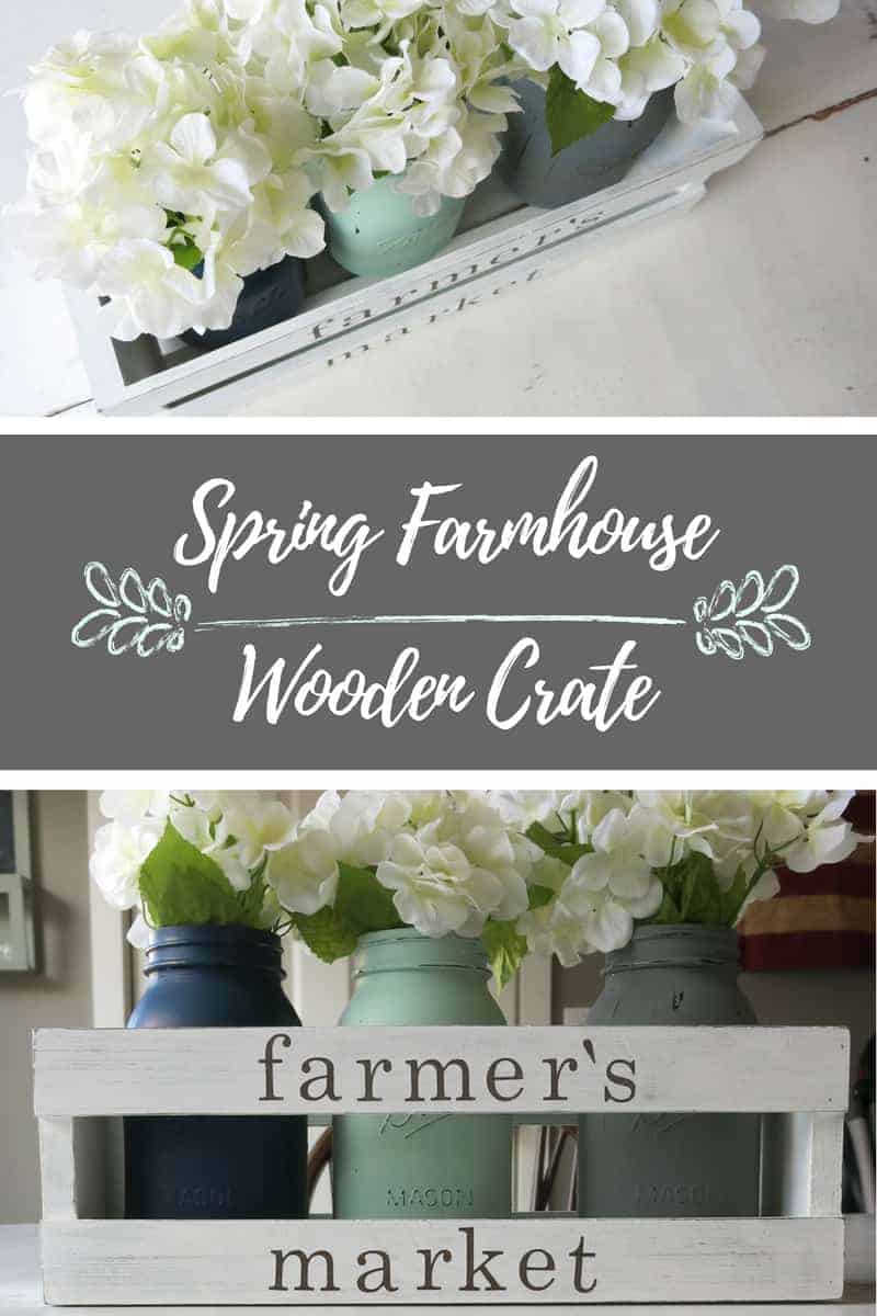 A collage of two images showing a DIY farmhouse centerpieces made with a wooden crate, painted mason jars, and flowers. Text in the center of the image says "Spring Farmhouse Wooden Crate"