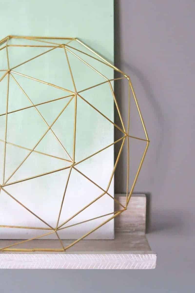 I made this DIY ombre mint canvas with some simple mint colored paint, and love the way it looks with this gold geometric sculpture