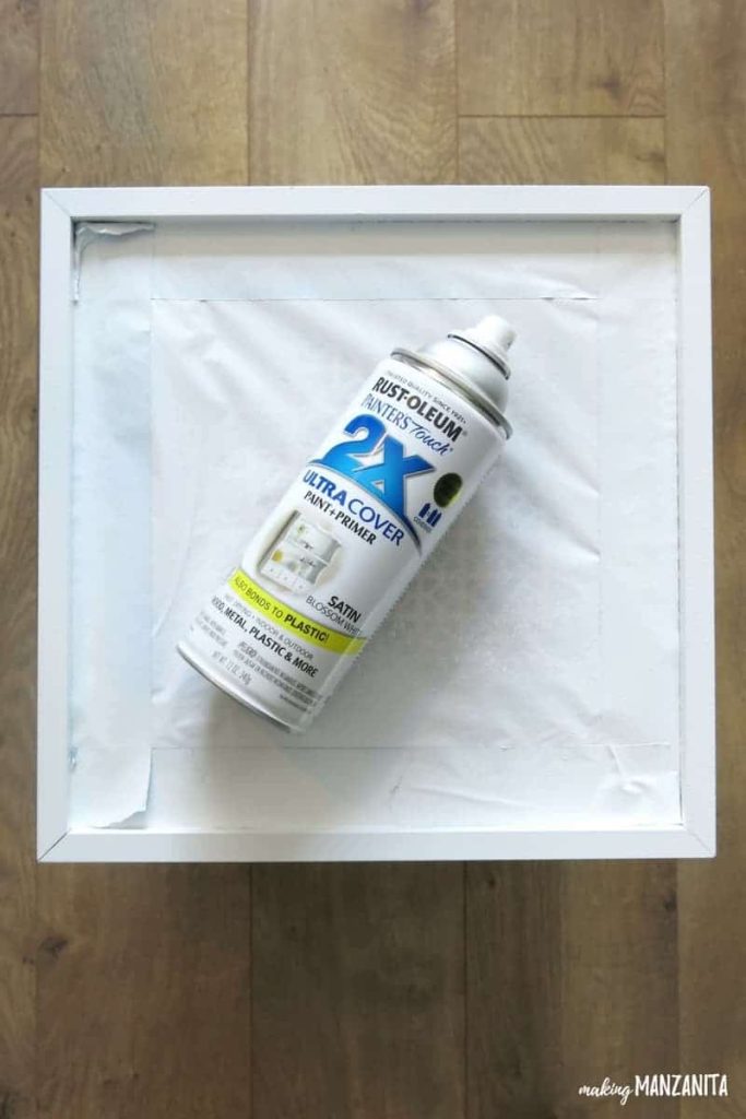 I used this white spray paint primer to spray the rest of the modem and router storage box, after applying painters tape where I don't want to paint.