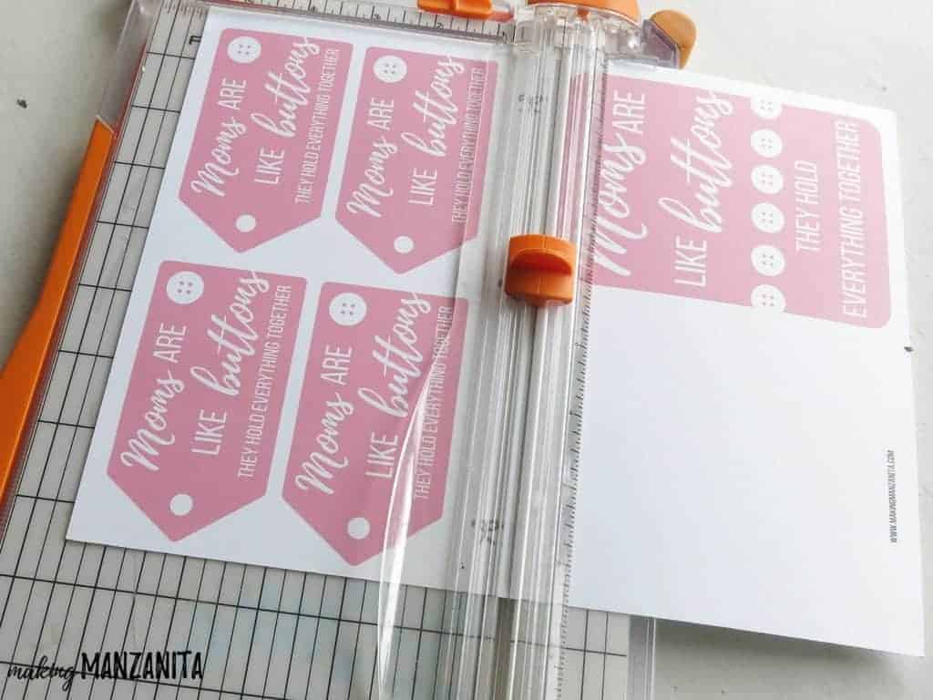 A sheet full of pink gift tags with white text that reads 