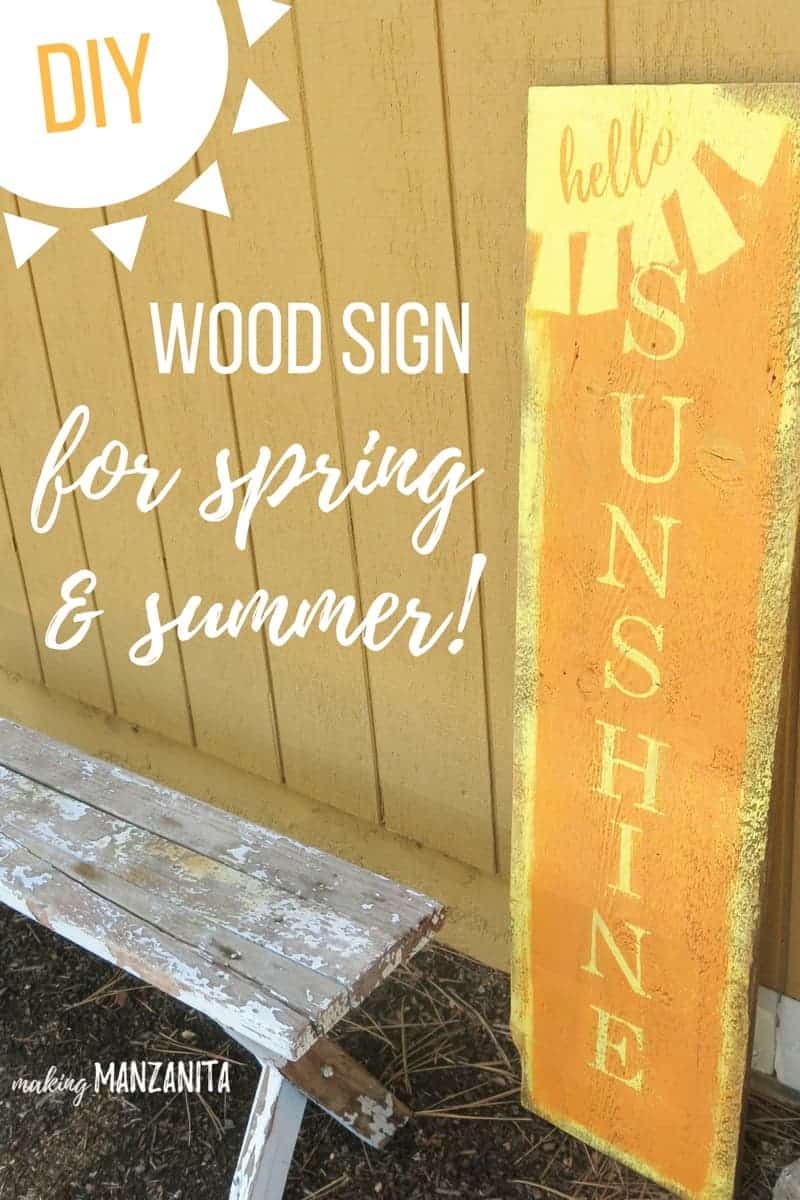 A large reclaimed wood sign that says "hello sunshine" in orange paint sits against a wall. Image text reads "DIY wood sign for spring and summer"