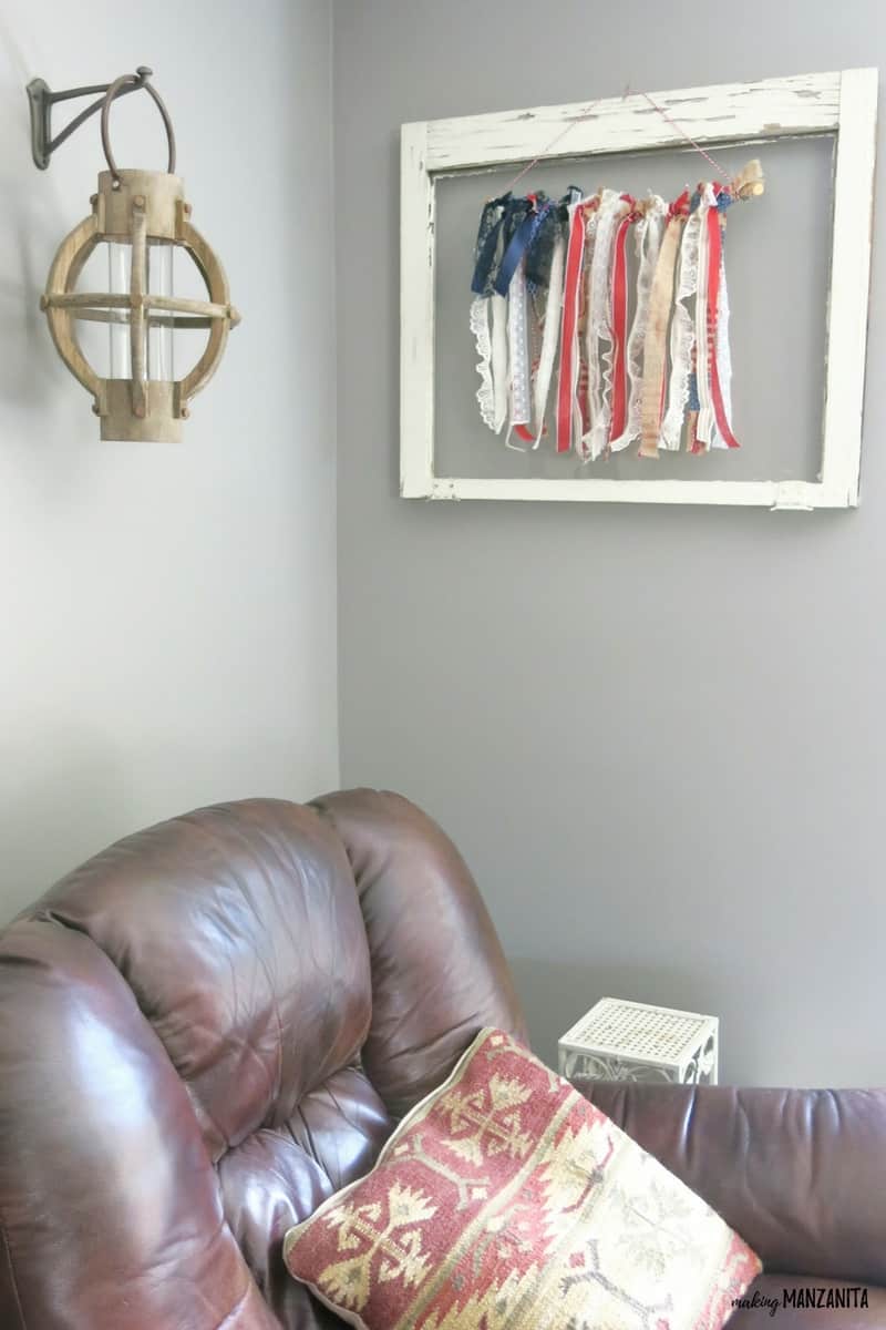 This ribbon flag is hanging on our wall inside a vintage weathered picture frame