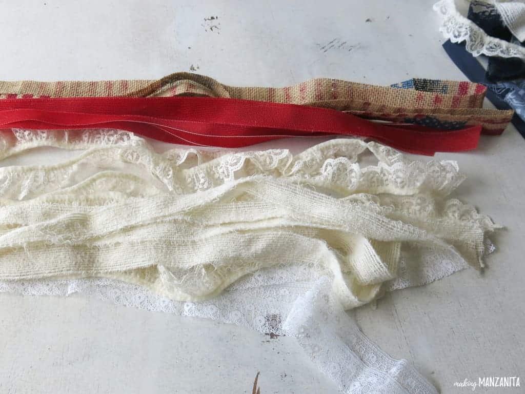 Strips of red and white ribbon to make a DIY American flag window hanging