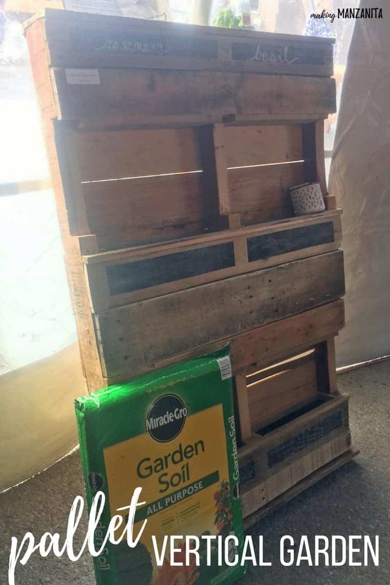 Supplies needed to make a vertical pallet garden. You need gardening soil (we're using Miracle Grow) and an old wood pallet.