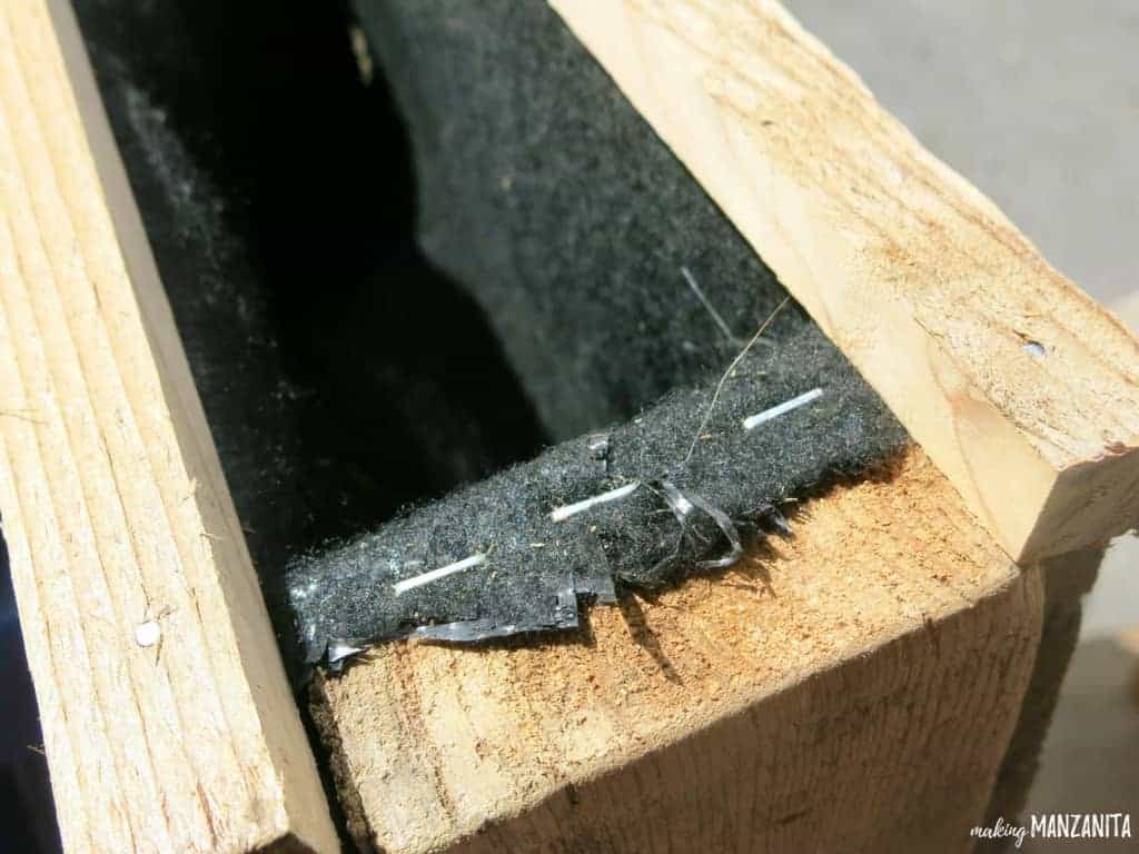 We used a staple gun to attach the landscaping fabric to the inside of wooden pallet, which will be used to create a vertical pallet garden.