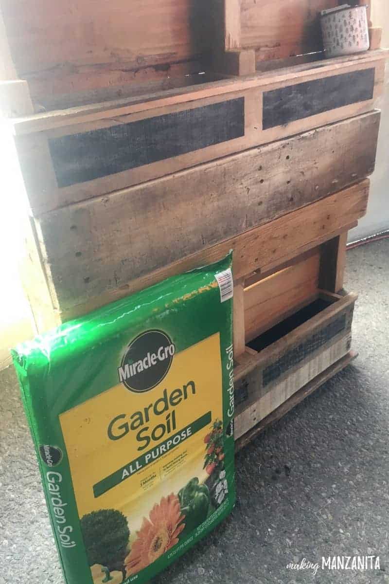 For our vertical planter garden, we'll be using Miracle-Gro all purpose garden soil.