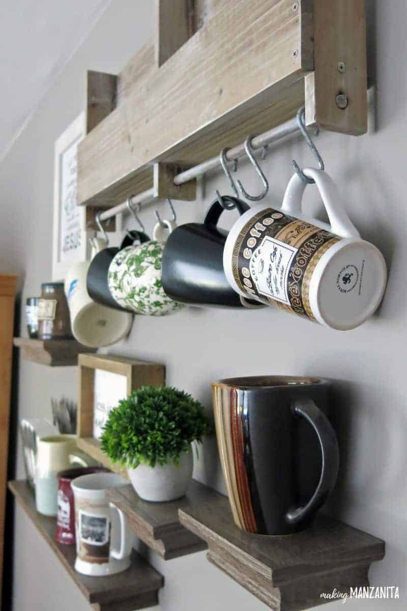 You definitely need storage for mugs in your coffee station at home. 
Take advantage of the wall space with floating shelves and hooks above your coffee station in a gallery wall format!