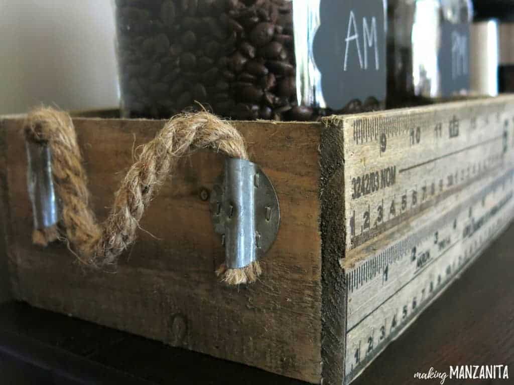 This vintage wood box works perfectly on our home coffee station for holding glass jars full of coffee beans labels AM and PM, designating caffeinated vs decaf coffee.