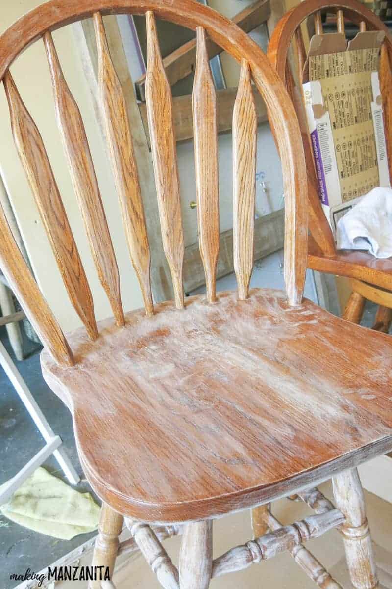 Wooden bar stools sanded down, ready to be primed for painting.