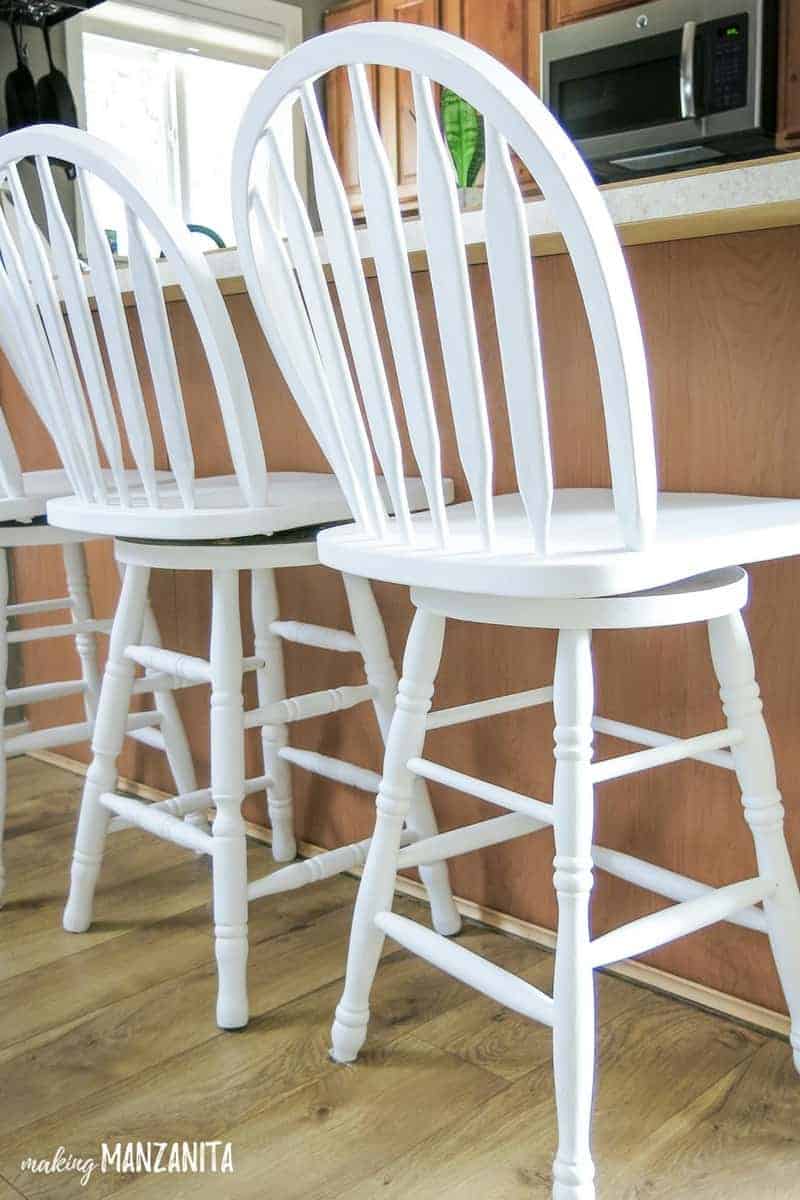 How to chalk paint bar stools - these three swiveling bar chairs are painted with General Finishes chalk paint for a farmhouse style finish.