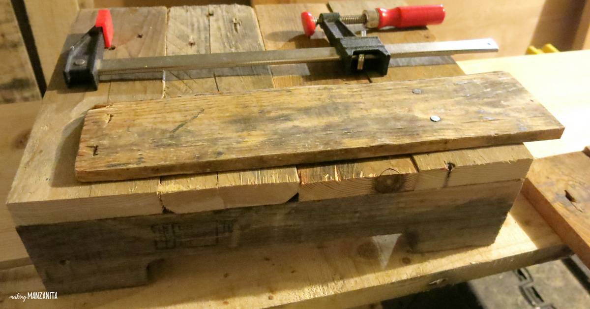 A look at pieces of pallet wood stacked together in the process of making a pallet wood side table
