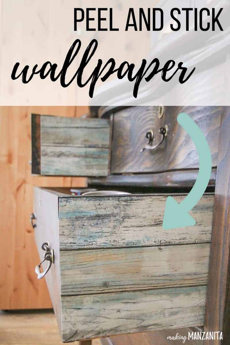 Open dresser drawer with colorful wallpaper added to the side of the drawer with text overlay that says peel and stick wallpaper with an arrow