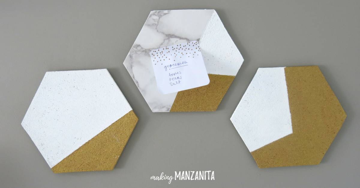 Three DIY hexagon cork boards on the wall in office being used a small wall mounted memo boards