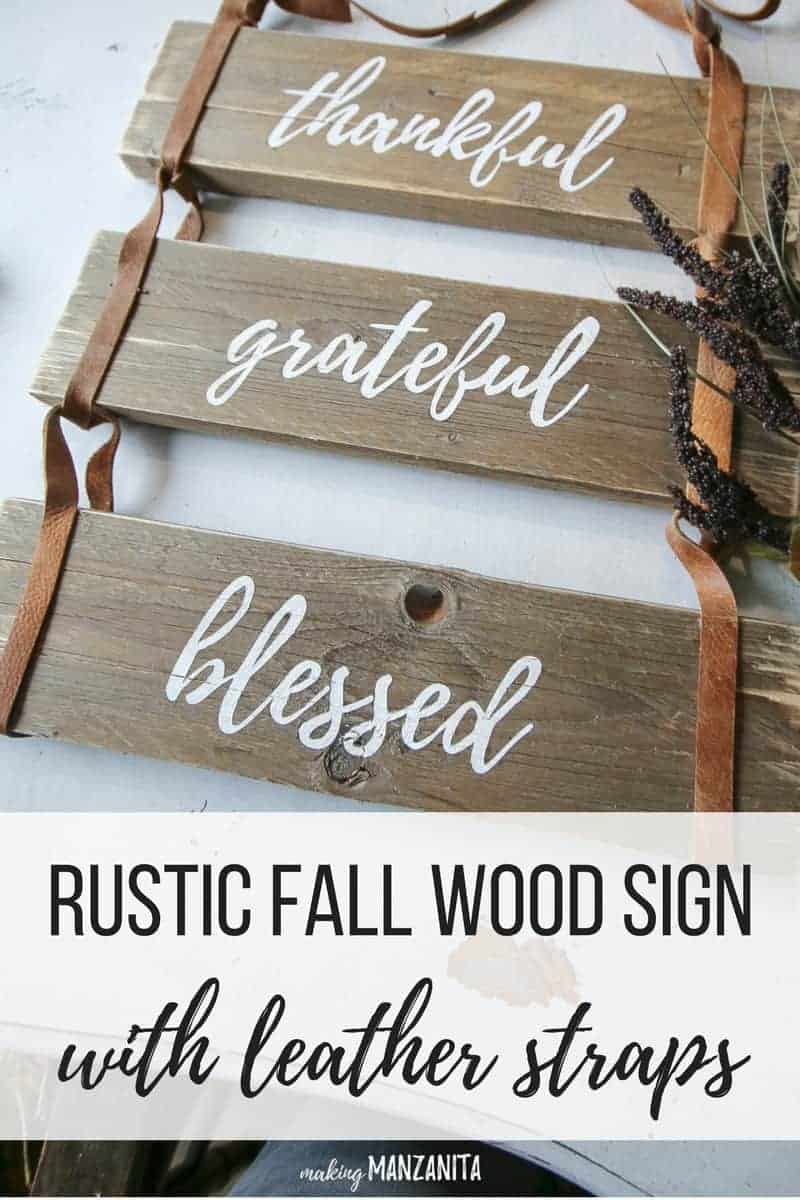 Rustic leather sign with pallet wood with dried grass on the side and text overlay that says Rustic Fall Wood sign with leather straps