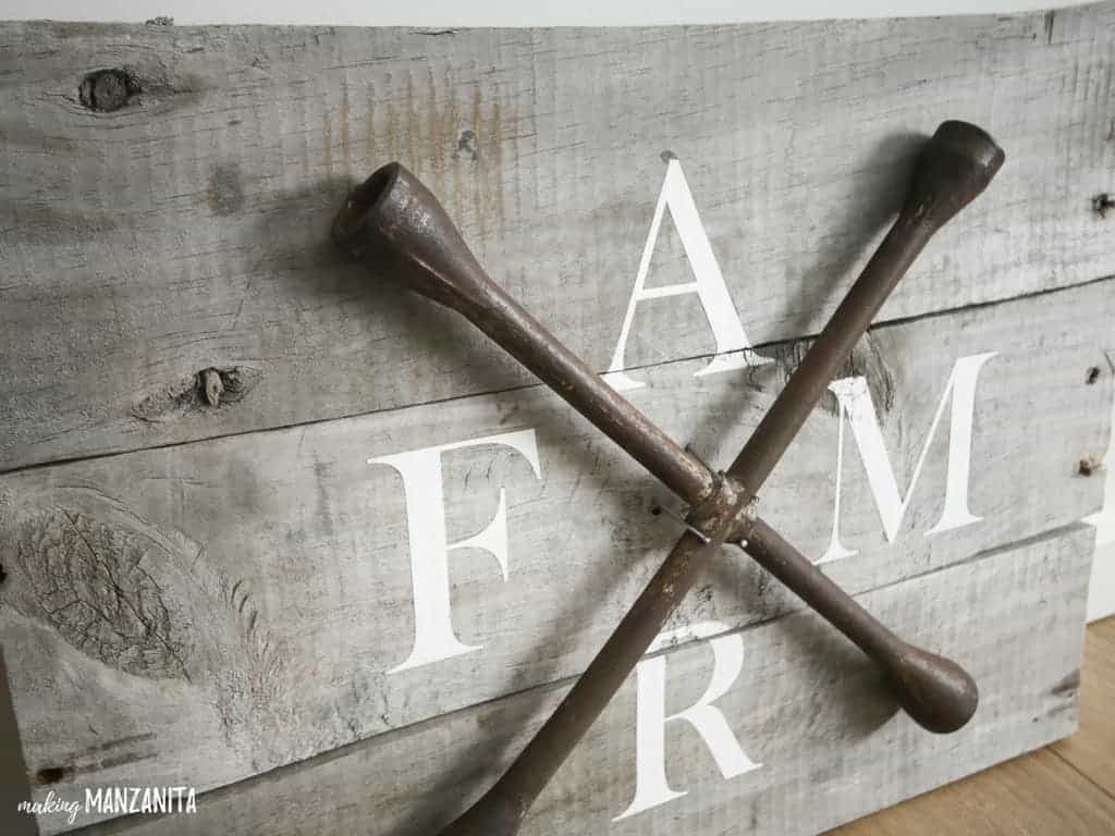 A full look at the final wood farmhouse style FARM sign, made from recycled pallet wood and recycled lug wrench. This farmhouse style sign is classic and vintage, perfect for any farmhouse style home!