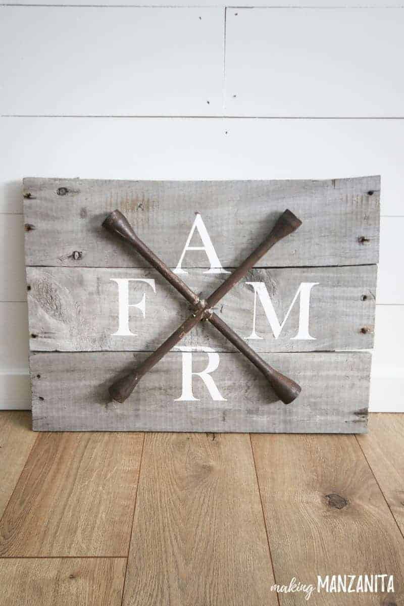 Our new farmhouse style FARM sign sits up against our shiplap wall in the living room.