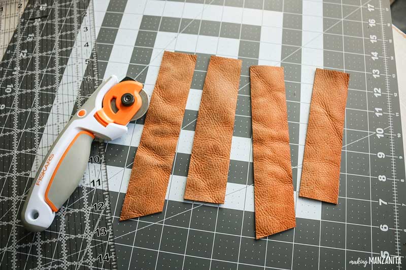 Cut the leather into strips using a cut mat, ruler, and rotary tool