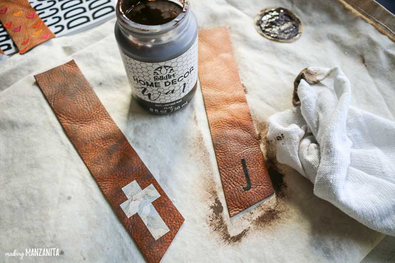 Use dark furniture wax to stain the DIY leather bookmarks