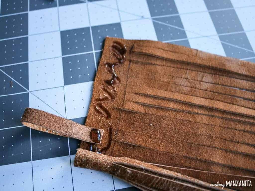 Roll up leather to make a leather tassel keychain