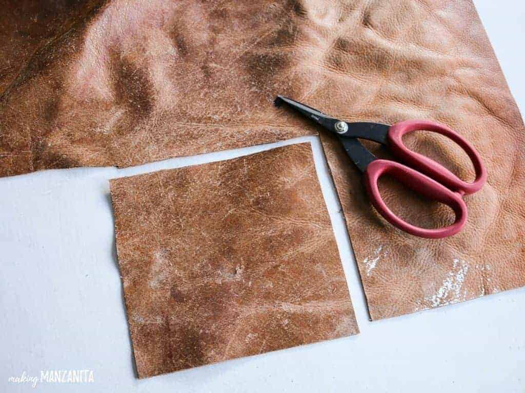 Cut a square from the leather scrap with scissors