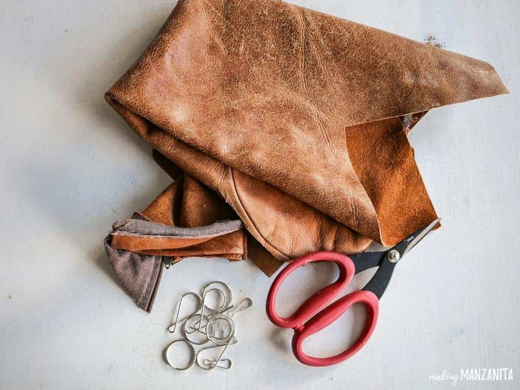 Leather scrap, scissors and chains - materials for diy leather keychains