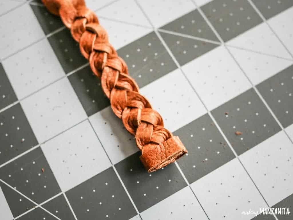 Secure the end of the braid with a small strip of leather