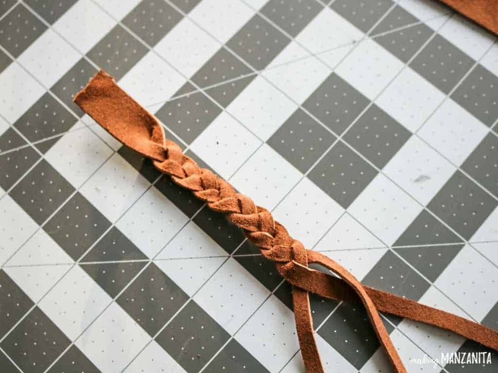 Cut then braid the leather strips to make a braided leather keychain