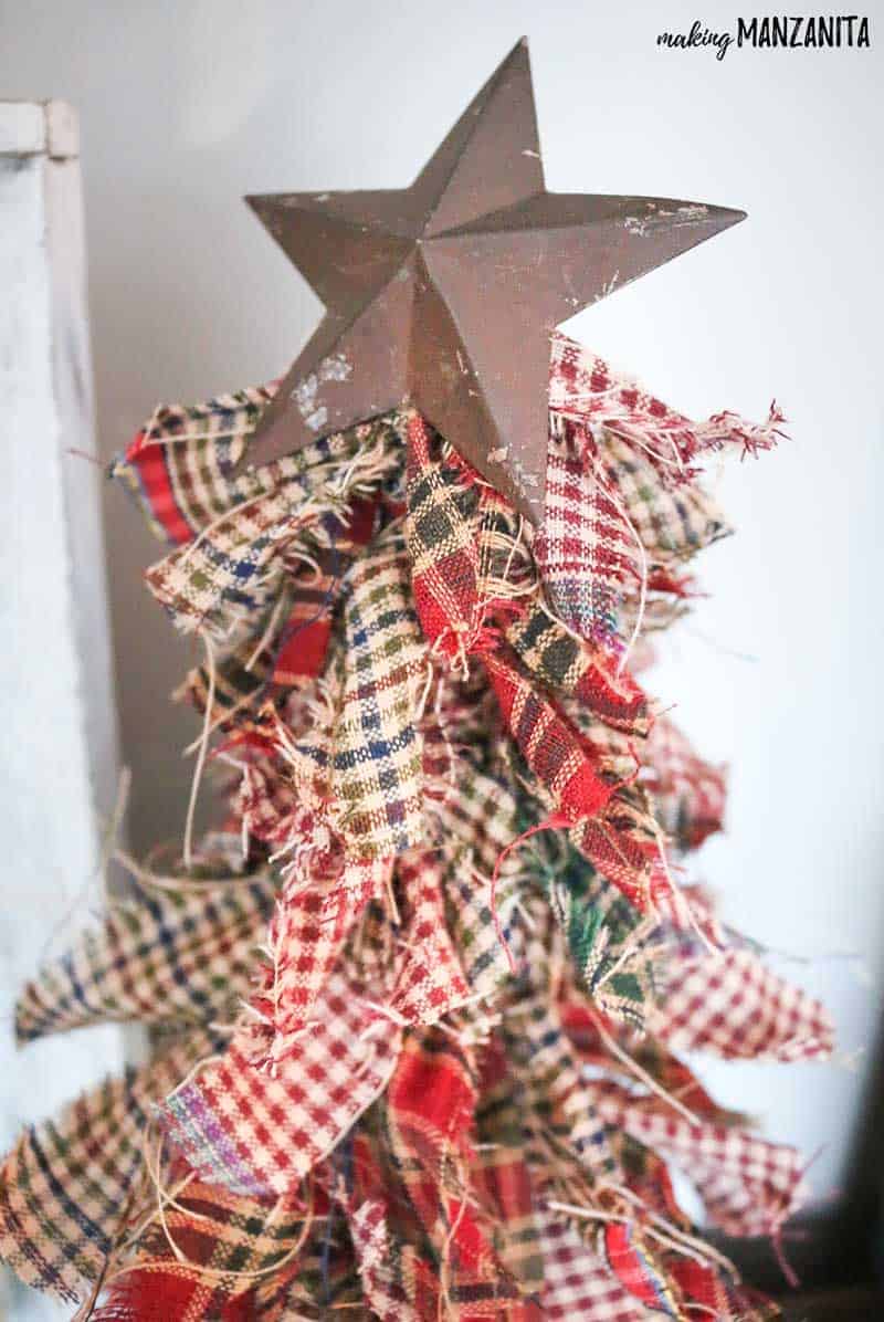 Finished fabric Christmas tree with vintage star on top.